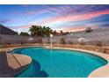 Sparkling pool nestled in a private backyard setting with a brick wall at 6320 Peppermill Dr, Las Vegas, NV 89146