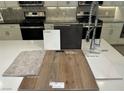 Kitchen sample featuring stainless steel appliances, Benton Flagstone cabinets, and Quartz Niagara countertop at 10004 River Corral St, Las Vegas, NV 89166