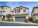 Beautiful two-story home with a two-car garage, desert landscaping, and a covered front entrance at 10722 Red Badge Ave, Las Vegas, NV 89166