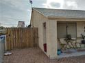 Side view featuring a covered patio area and access to the property's fenced-in yard at 110 Palm Ln, Las Vegas, NV 89101