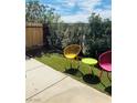 Cozy backyard featuring unique modern patio furniture and lush greenery at 228 E Van Wagenen St, Henderson, NV 89015