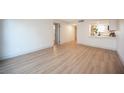 Spacious living room with hard surface floors and view of the kitchen at 3823 S Maryland Pkwy # L6, Las Vegas, NV 89119