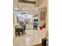 Well-lit kitchen features white cabinets, stainless steel appliances, and a cozy breakfast nook at 533 Calypso Dr, Henderson, NV 89002