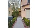 Charming home entrance with inviting walkway, surrounded by manicured bushes and landscaping at 5661 Bonds Flat St, Las Vegas, NV 89148