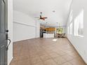 Open-concept living space features neutral paint, tile flooring and lots of natural light at 5912 Cuddles Ct, North Las Vegas, NV 89081