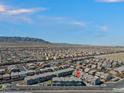 Aerial view of a residential community featuring desert landscaping and mountain views at 6447 Wide Sky St, Las Vegas, NV 89166