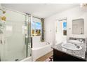 Bright bathroom with double sinks, granite counters, tiled floors, and shower and tub combo at 7529 Earnshaw Avenue Ct, Las Vegas, NV 89179
