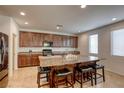 Spacious kitchen featuring a large central island with seating and abundant cabinet space at 7579 Harwich Bay Ave, Las Vegas, NV 89179