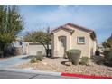 Charming single-story home featuring low-maintenance landscaping and an attached two-car garage at 7726 Coast Jay St, North Las Vegas, NV 89084