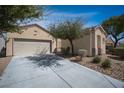 Charming single-story home featuring low-maintenance landscaping and an attached two-car garage at 7726 Coast Jay St, North Las Vegas, NV 89084