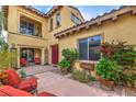 Backyard view with a patio, seating, and well-manicured plants adding a touch of elegance at 79 Rezzonico Dr, Henderson, NV 89011