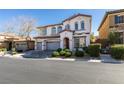Charming two-story home featuring a three-car garage, lush landscaping, and inviting curb appeal at 8743 Mount Mira Loma Ave, Las Vegas, NV 89178