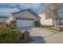 Charming one-story home featuring a two-car garage and well-maintained landscaping at 9323 W Rochelle Ave, Las Vegas, NV 89147