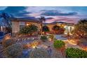 Beautifully landscaped single-story home with stone pathway and desert landscaping at 2167 Fairweather St, Henderson, NV 89052