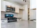 Kitchen view showcasing gray countertops, stainless steel appliances and white cabinets at 2200 S Fort Apache Rd # 2023, Las Vegas, NV 89117