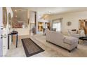 Bright living room with neutral colors, tiled floors, vaulted ceilings and an open floor plan at 2766 Chokecherry Ave, Henderson, NV 89074