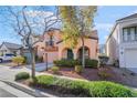 Attractive two-story home featuring a cozy balcony, archways, and low-maintenance landscaping at 2851 Glistening Grove Ave, Henderson, NV 89052