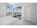 Bright bedroom features city views, a private balcony, and a spacious closet at 322 Karen Ave # 1507, Las Vegas, NV 89109
