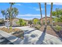 Charming exterior showcasing well-manicured landscaping and a circular driveway at 337 Glenridding St, Las Vegas, NV 89183