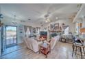 Bright and inviting living room featuring a stone fireplace and open layout, with views outdoors at 3424 Mount Charleston Dr, Pahrump, NV 89048