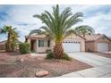 Attractive single-story home with desert landscaping and a convenient two-car garage at 5014 Sail Rock Pl, North Las Vegas, NV 89031