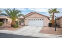 Inviting single-story home featuring desert landscaping and a two-car garage at 5014 Sail Rock Pl, North Las Vegas, NV 89031