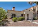 Single story home with stucco exterior, terracotta roof and gravel landscaping at 508 Indian Princess Dr # 104, Las Vegas, NV 89145