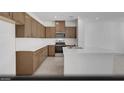 Modern kitchen featuring stainless steel appliances, ample counter space, and stylish cabinetry at 5733 Crenellated St # Lot 67, Las Vegas, NV 89148