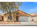 Charming single-story home with desert landscaping and a two-car garage at 6037 Soft Springs Ave, Las Vegas, NV 89130
