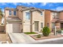 Attractive two-story home with garage and low maintenance front yard at 6066 El Sol Dr, Las Vegas, NV 89142