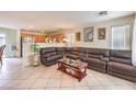 Open-concept living room featuring tile floors, neutral walls, and a spacious seating area at 6066 El Sol Dr, Las Vegas, NV 89142