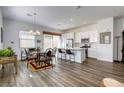 Bright living space featuring wood floors, recessed lighting, and an open layout connecting to the kitchen at 762 Lilac Oak St, Henderson, NV 89011
