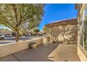 Relaxing outdoor patio area with concrete flooring and a surrounding wall, perfect for entertaining at 7824 Homing Pigeon St, North Las Vegas, NV 89084