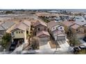 An aerial view of the neighborhood showcasing multiple homes, streets, and surrounding desert landscape at 8646 Mesquite Hills St, Las Vegas, NV 89139