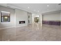 Spacious living room with a fireplace, recessed lighting, and ample natural light at 88 Pristine Glen St, Las Vegas, NV 89135