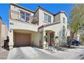 Lovely two-story home with an attached garage, balcony, and manicured landscaping at 8868 Intertwine, Las Vegas, NV 89149