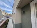 A quaint home exterior with an inviting walkway and attractive exterior lighting fixtures at 9126 Haddington Ln, Las Vegas, NV 89145