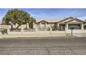 Charming single-story home with manicured landscaping, three-car garage, and RV parking at 1630 Sundown Dr, Henderson, NV 89002