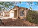 Beautiful single-story home with a well-kept yard, a spacious driveway, and a charming entrance at 2410 Morocco Ave, North Las Vegas, NV 89031