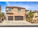 Stunning two-story house with tile roof, desert landscaping and a spacious two-car garage at 260 Pioneers Peak, Henderson, NV 89002