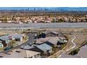 Expansive aerial view of the surrounding community with the city skyline visible in the distance at 2931 Raywood Ash Dr, Las Vegas, NV 89138
