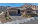 Charming single-story home with a three-car garage and desert landscaping at 2931 Raywood Ash Dr, Las Vegas, NV 89138