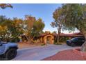 Beautiful single-story home with mature landscaping, circular driveway, and ample parking space at 3132 El Camino Rd, Las Vegas, NV 89146