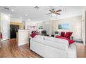 Bright, open living area with wood floors, neutral walls and abundant natural light at 3405 Robust Robin Pl # 3, North Las Vegas, NV 89084