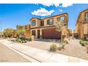 Lovely two-story home featuring a brick driveway, a two-car garage, and low-maintenance landscaping at 4423 Creekside Cavern Ave, North Las Vegas, NV 89084