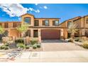 Charming two-story home with a brick driveway, a two-car garage, and manicured landscaping at 4423 Creekside Cavern Ave, North Las Vegas, NV 89084