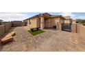 Paver driveway and walkway with small patch of green with bench, leading to the home's entrance at 4611 Julesburg Dr, Las Vegas, NV 89139