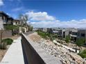 Residential street showcasing sidewalks, desert landscaping, and multiple modern homes at 492 Pear Lake St, Las Vegas, NV 89138