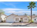 Charming single-story home features a well-manicured yard, tile roof, and a single palm tree at 4932 Forest Oaks Dr, Las Vegas, NV 89149