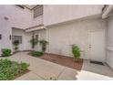 Charming courtyard entrance with well-maintained landscaping and walkways at 5201 S Torrey Pines Dr # 1223, Las Vegas, NV 89118